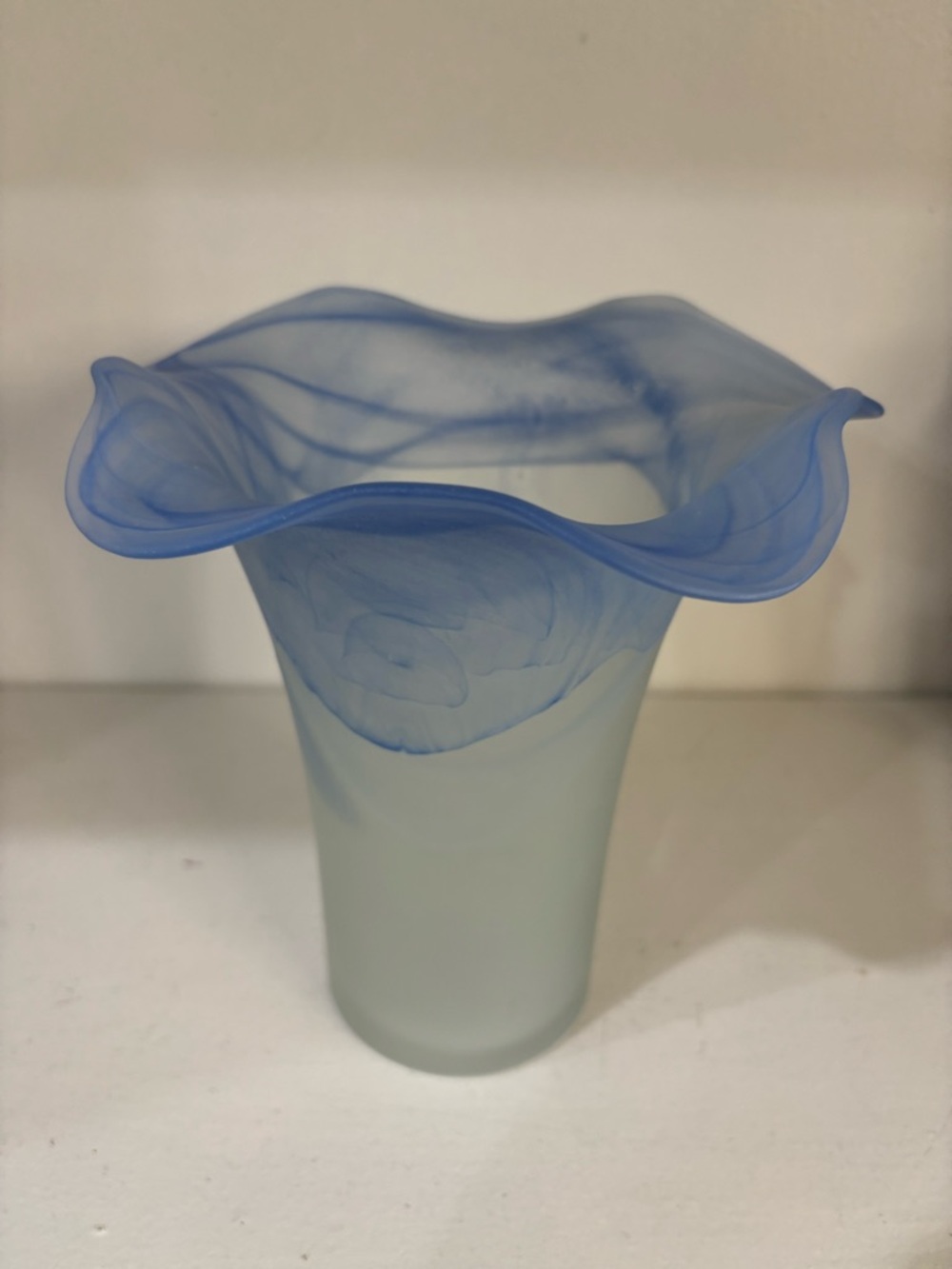 Blue and white swirl ribbon edge glass vase